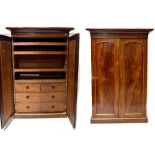 A Victorian mahogany linen press, two doors with arched raised panels,