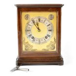 A 20th century mahogany-cased eight-day chiming mantel clock,