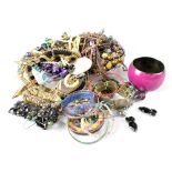 A quantity of costume jewellery to include bracelets, necklaces, earrings, etc.