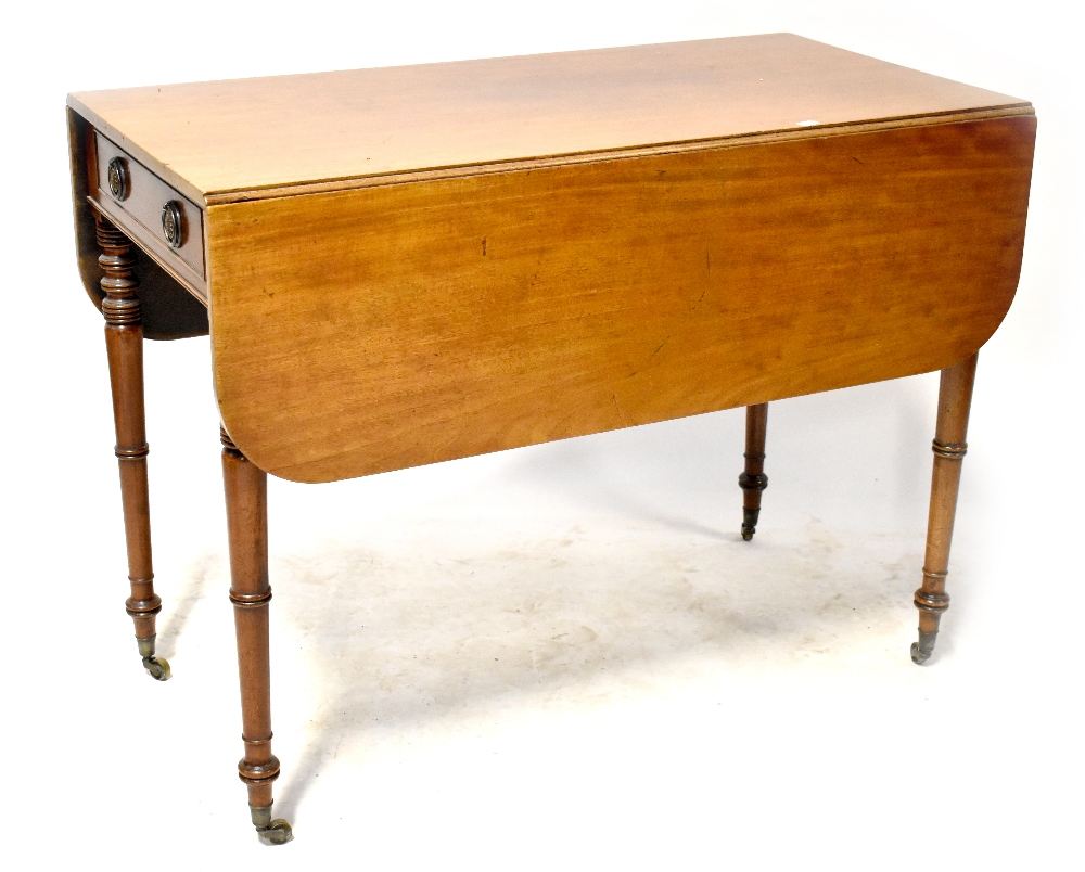 A 19th century mahogany Pembroke table with single frieze drawer opposed by a dummy drawer,