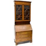 An Edwardian inlaid mahogany bureau bookcase,