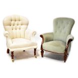 A Victorian-style button-back armchair upholstered in cream woven fabric and on turned legs with