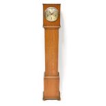 A 1930s oak-cased grandmother clock,