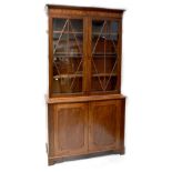 A 19th century mahogany bookcase, the top with a pair of astragal glazed doors,