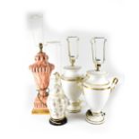 Four decorative ceramic lamps to include a pair of twin-handled Classical-style white ground table