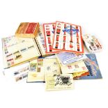 A folder and Stanley Gibbons Postbox stamp albums containing a quantity of stamps to include