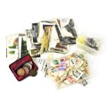 A small quantity of coins, banknotes, loose stamps and postcards, mainly topographical.