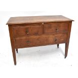 An early 20th century oak chest of two short drawers over one long drawer on tapered supports to