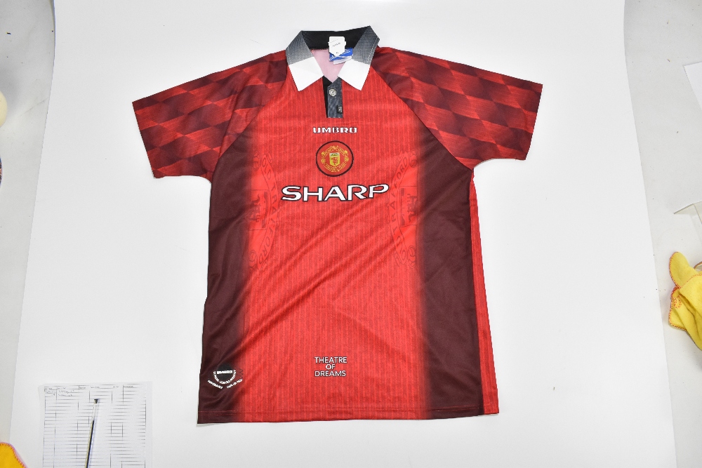 MANCHESTER UNITED FC; an Umbro official retro-style shirt with embroidered logo signed by Eric - Image 2 of 2