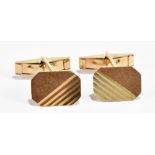A pair of 9ct yellow gold cufflinks with textured and linear detail with base metal clips, approx
