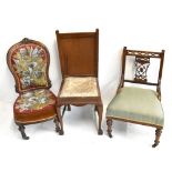 A Victorian walnut framed nursing chair upholstered in beaded back and seat cushions, together