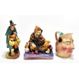 ROYAL DOULTON; two figures comprising HN1493 'The Potter' and HN2103 'The Mask Seller', also a