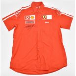 MICHAEL SCHUMACHER; a signed Scuderia Ferrari Fila official shirt with embroidered logos, size XXL.