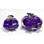 Two circa 1970s purple perspex ceiling light shades each with relief decoration, diameter of largest