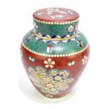 An early 20th century Chinese cloisonné and ceramic ginger jar and cover decorated with floral