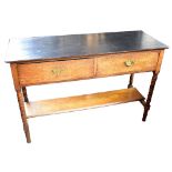 An oak side/hall table with black chalk painted top above two short drawers and under-tier on turned