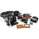 A group of cameras and accessories including a Zenit-B with Helios-44 2/58 lens, Zorki-4K camera