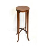 An Edwardian inlaid mahogany jardinière stand, raised on outswept support, height 83cm, diameter