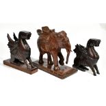 An Indian carved model of an elephant, raised on rectangular plinth base, height 32cm, length