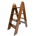 A set of reproduction mahogany folding step ladders with brass hinges, height 95cm.Additional