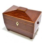 A 19th century partridge wood tea caddy, the hinged cover enclosing two compartments, with ivory