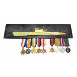 A Royal Naval Reserve World War I and World War II medal group of nine comprising War, Victory and