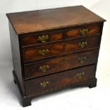 An early 19th century mahogany chest of small proportions with two short over three long drawers,