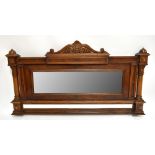 A Continental kingwood headboard converted to an overmantel mirror, with applied mirrored plate