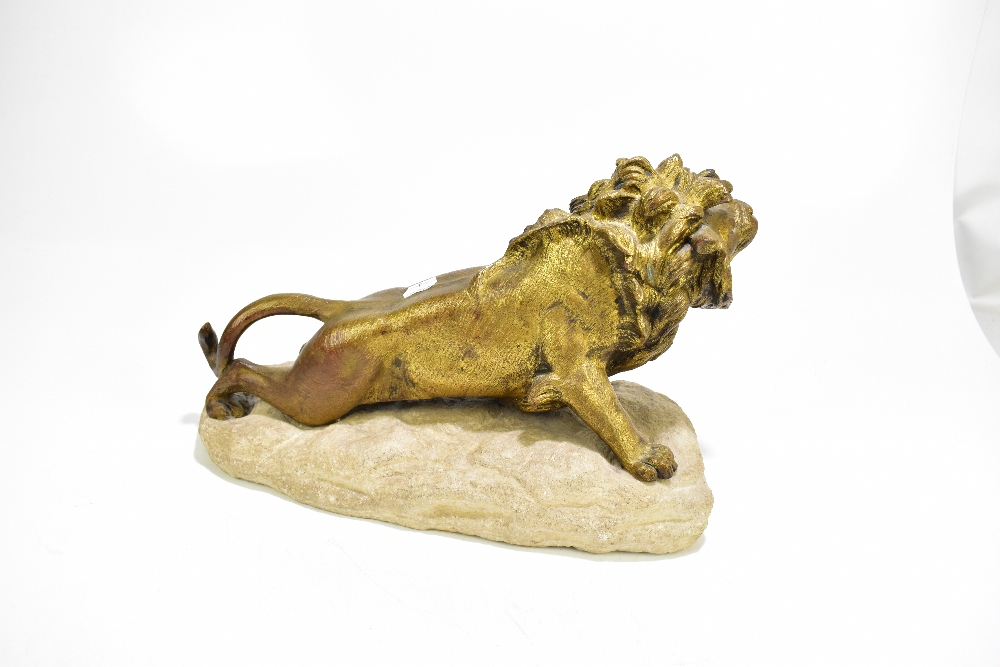 ROBERT BOUSQUET (1888-1917); a gilt bronze model of a stalking lion, signed to white stone base, - Image 2 of 2