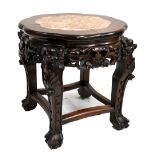 A reproduction Chinese rosewood jardinière stand with marble inset top, raised on ball and claw