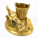 A gilt bronze match holder of oval form depicting a chicken beside basket on naturalistically