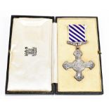 A WWII RAF Distinguished Flying Cross, stamped 1945 to reverse, on original suspension and ribbon in