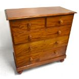A Victorian mahogany chest of two short over three long drawers, raised on bun feet, height 110cm,