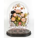 A Victorian wax diorama decorated with fruit, presented inside glass dome, overall height 41cm.