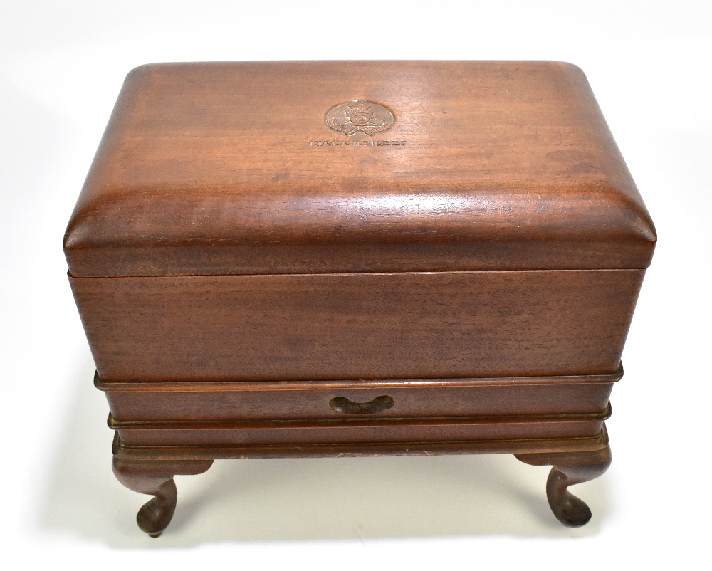 An early 20th century Indian mahogany campaign chest with hinged cover and carved detail, Royal