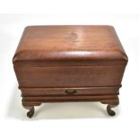 An early 20th century Indian mahogany campaign chest with hinged cover and carved detail, Royal