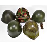 Five military helmets comprising Bulgarian Army M36 B1, Hungarian Army example, Bulgarian Army M51-