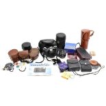 A collection of assorted camera equipment to include Canon F:3.5 135mm lens, fitted in leatherette