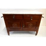 An Edwardian marble top wash stand, with two drawers above two panelled cupboard doors, with