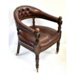 A 19th century oak framed leather upholstered bowback elbow chair on turned supports with brass