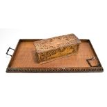 An early 20th century carved oak rectangular tray, 74 x 36.5cm, and a rectangular storage box with