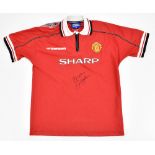 MANCHESTER UNITED FC; an Umbro reproduction 1998-1999 Treble Winning Season junior home shirt with