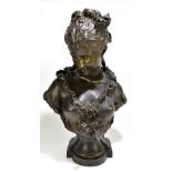 AFTER MOREAU; an early 20th century bronzed spelter bust of a maiden wearing floral attire, with