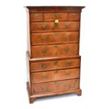 A George III walnut chest on chest with moulded cornice above arrangement of six drawers to upper