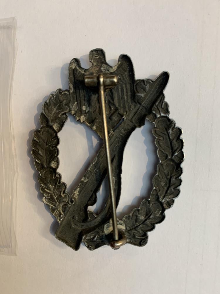 A Third Reich Infantry Assault badge, length 6cm.Additional InformationGeneral wear throughout. - Image 2 of 2