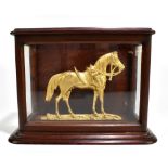 A 19th century mahogany glazed cabinet enclosing a gilt model of a horse, the cabinet 24 x 30 x