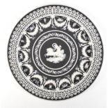 WEDGWOOD; a good late 19th century black and white jasper dip plate centred with a horse-drawn