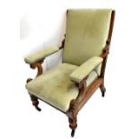 A late Victorian mahogany framed reclining armchair upholstered in a suedette material, raised on