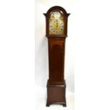 An Edwardian mahogany cased longcase clock, the brass dial inscribed ‘Tempus Fugit’ above silvered