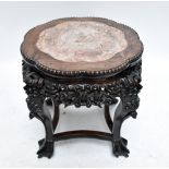 A late 19th century Chinese Huang Huali jardinière stand with rouge marble inset and carved